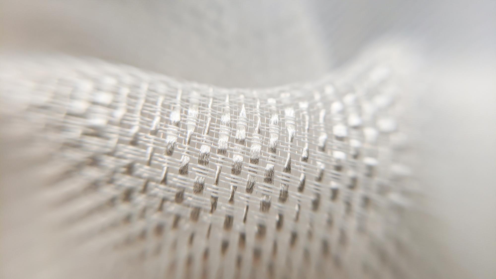 Close-up of embroidered futuristic pattern on fabric